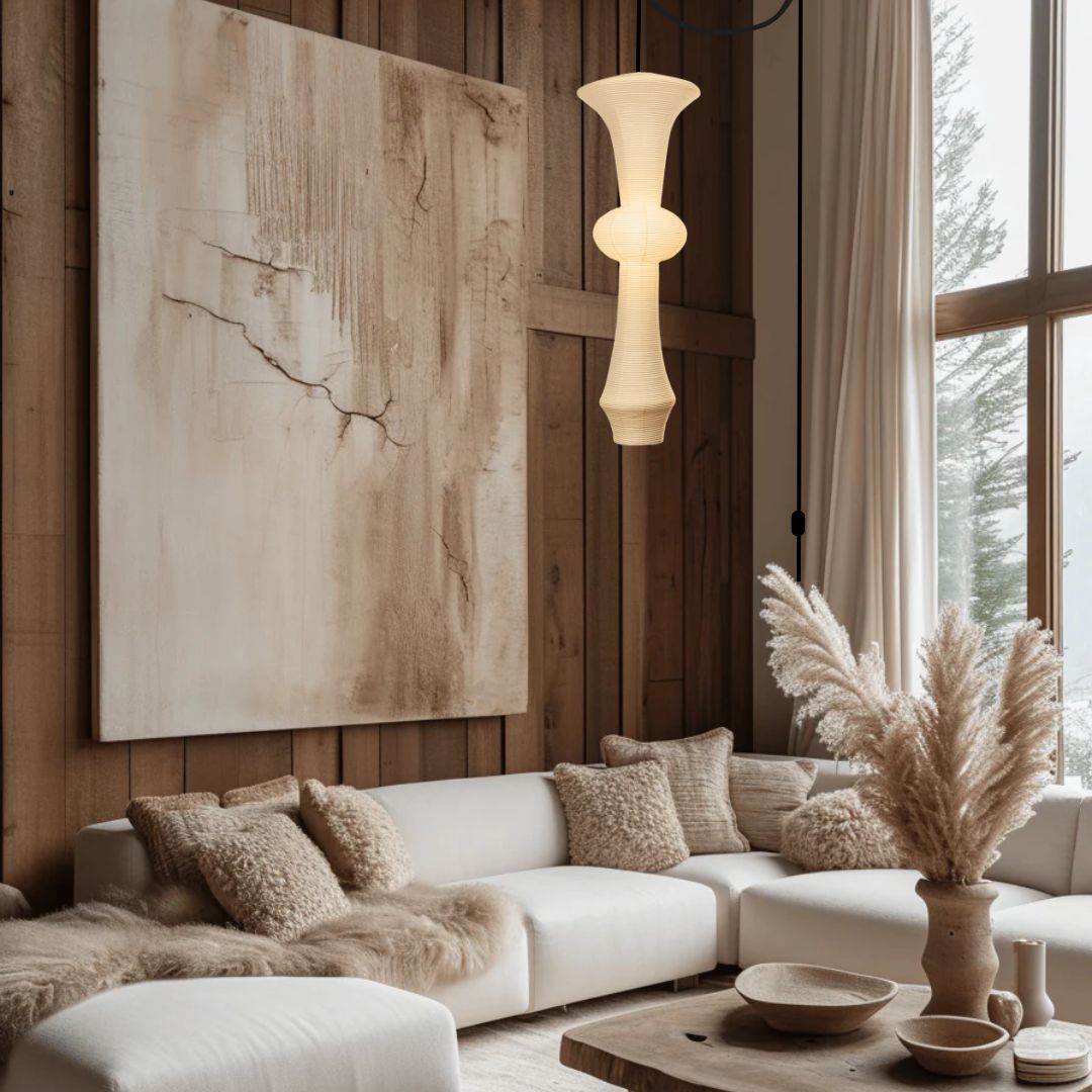 Japanese rice paper pendant light hanging in a modern living room with warm glow and neutral decor