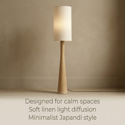 Minimalist floor lamp for calm interiors, featuring soft linen light diffusion and an organic wooden design in a Japandi-style aesthetic.