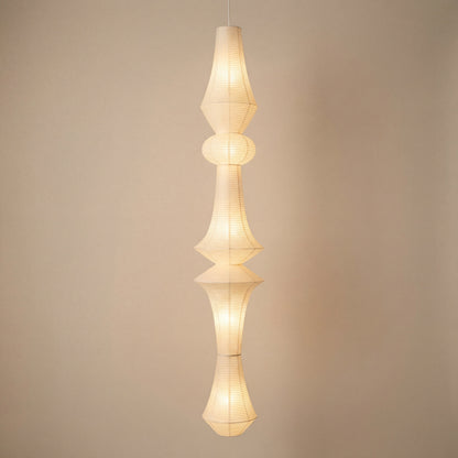 Handcrafted rice paper pendant light with a tall sculptural design, ideal for Japandi or mid-century modern spaces.