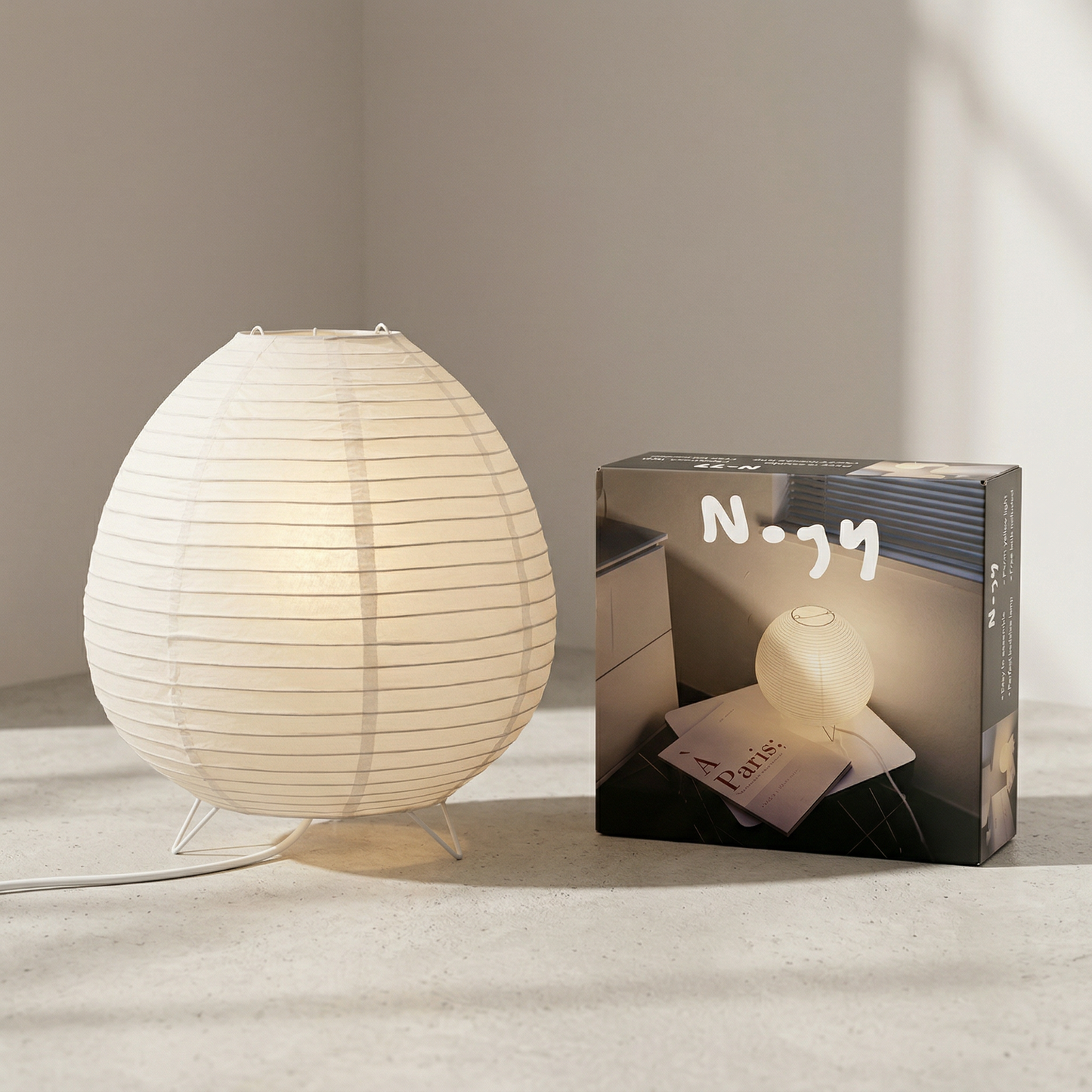 Japanese-style Washi paper table lamp with metal base perfect for minimalist home decor.