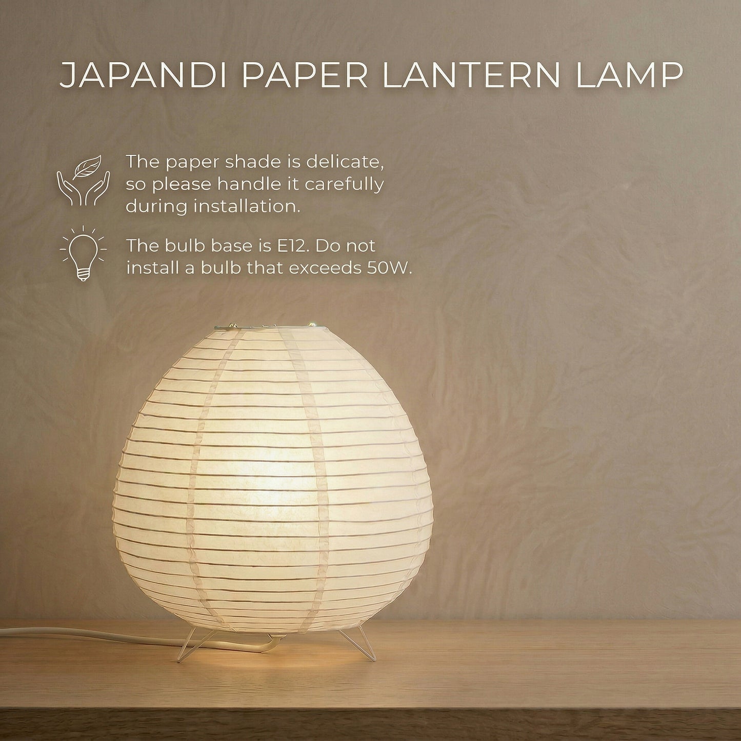 Japandi paper lantern lamp on a wooden table with text overlay noting the delicate paper shade requires careful installation and the E12 bulb base has a 50W maximum limit.