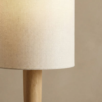Close-up detail of our premium floor lamp, showing high-quality linen shade diffusion and natural solid wood construction.