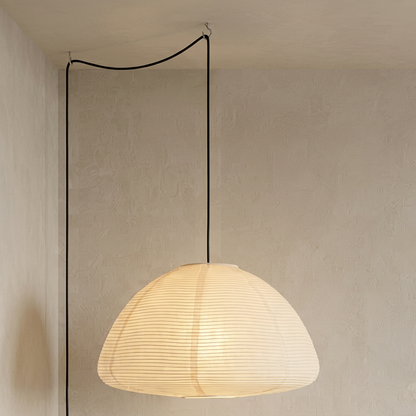 Elegant Japanese rice paper pendant light with metal ribbing and soft white paper shades, providing warm ambient lighting.