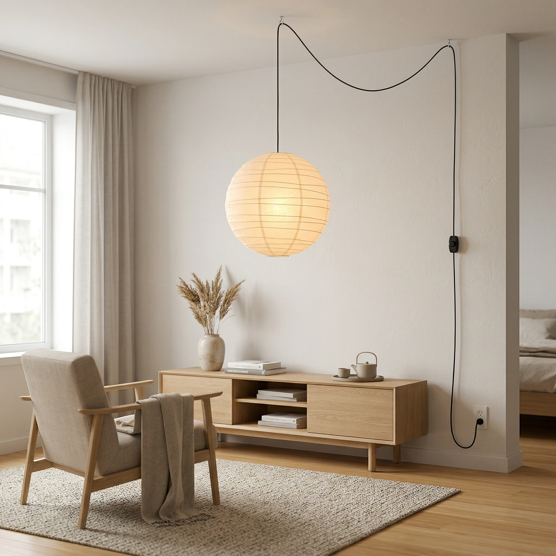 Japandi style plug-in rice paper globe pendant lantern in a bright Scandinavian living room with neutral decor